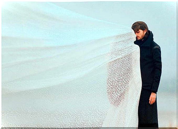 man-facing-a-woman-in-a-white-veil